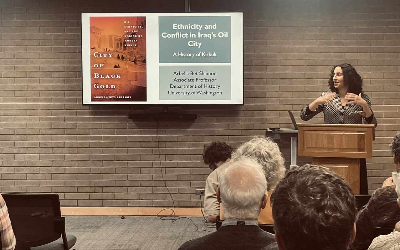 Associate professor of history presenting on "Ethnicity and Conflict in Iraq's Oil City"
