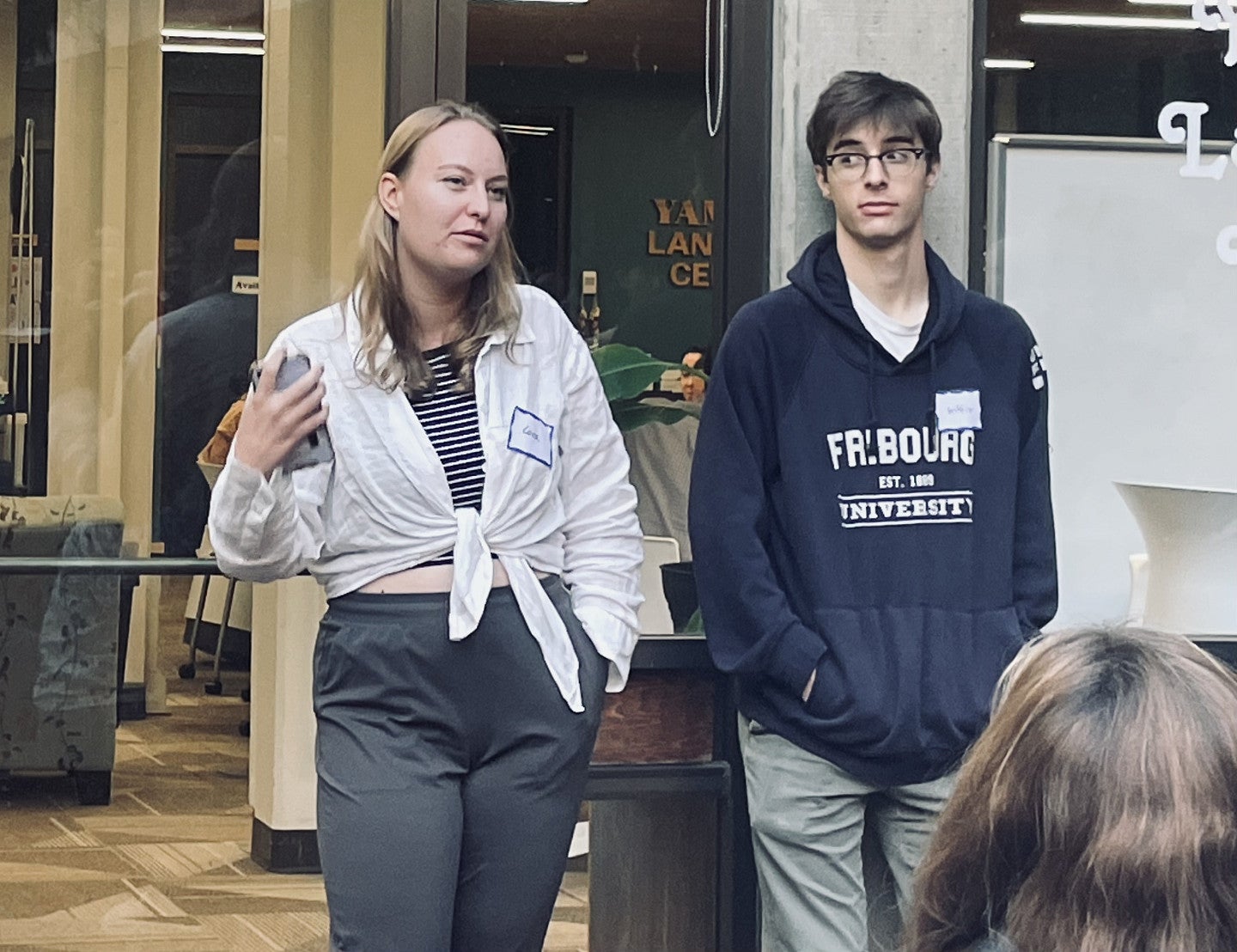 A woman speaking to students outside of McKenzie