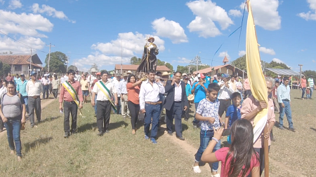 Bolivian indigenous people in parade with flags