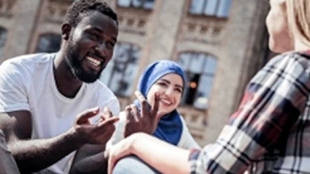 group of students talking outside