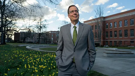 Karl Scholz posing outside on the UO campus