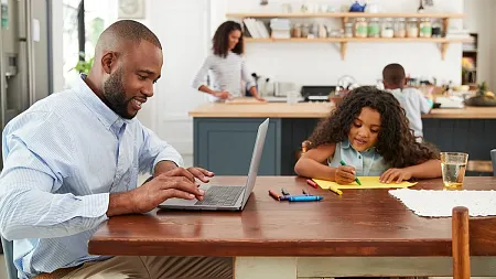 Family working at the dinner table