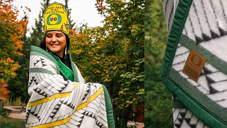 Miss Indigenous UO, Keyen Singer, modeling the Home Flight Blanket from 8th Generation