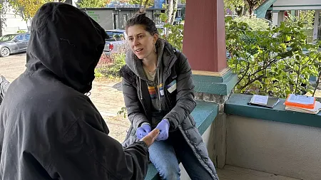 Jo Weaver talks with a research participant