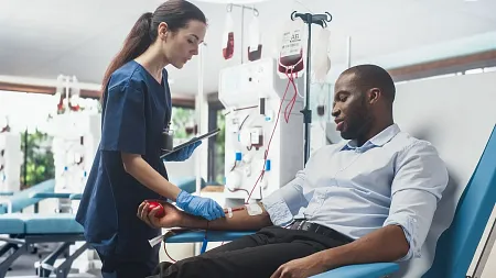 a medical professional works with a patient