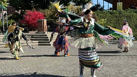 Native American students dressed in regalia performing a dance in the EMU Amphitheater on Oct. 14, 2024 as part of the Native American Student Union's Indigenous Peoples Day event