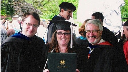 Rachel Bitecofer dressed in a cap and gown for commencement