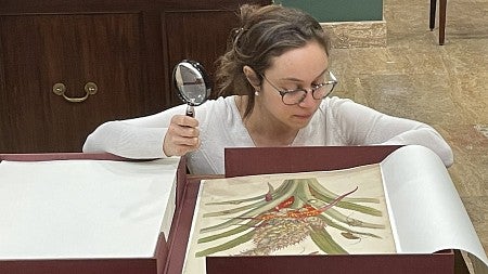 a woman with a magnifying glass