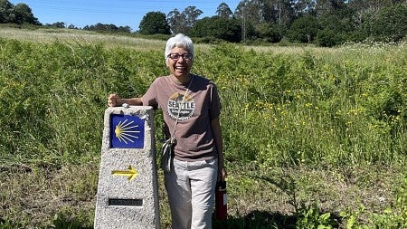 Laura Pulido in the outdoors beside a monument