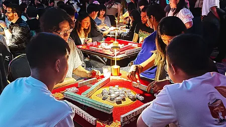a crowd people playing tabletop games