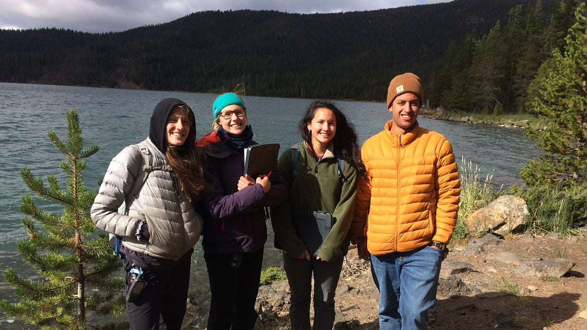 ELP Students posing next to lake