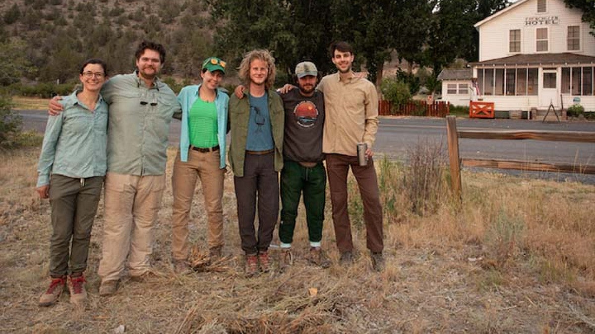 students grouped together on location outdoors