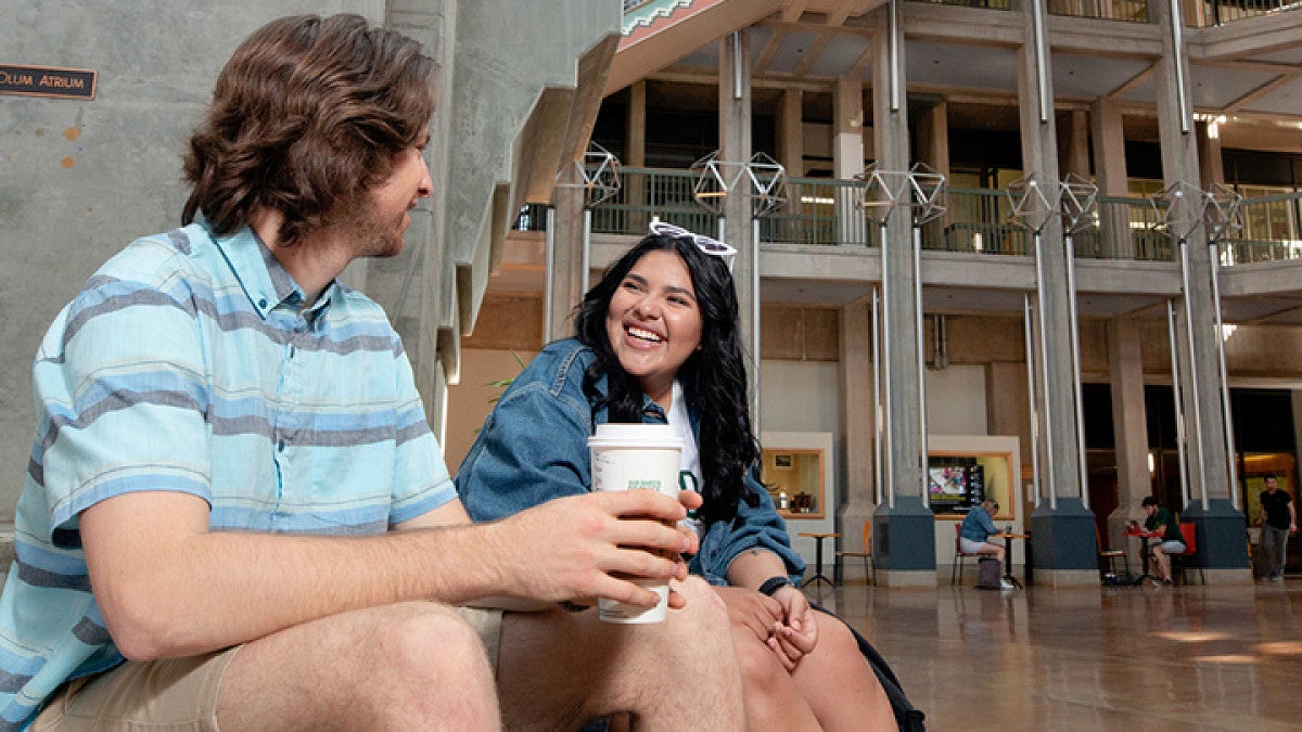 Two students talking in Willamette Hall