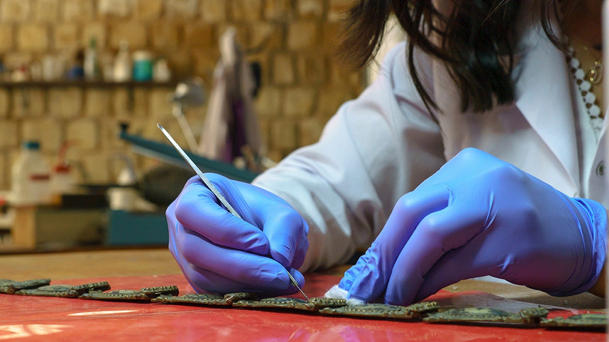 Woman analyzing a artifact