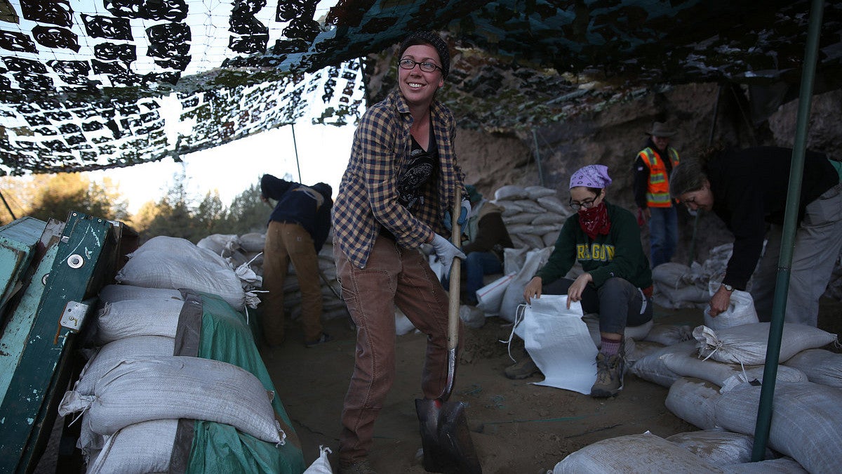 A researcher digs on a site