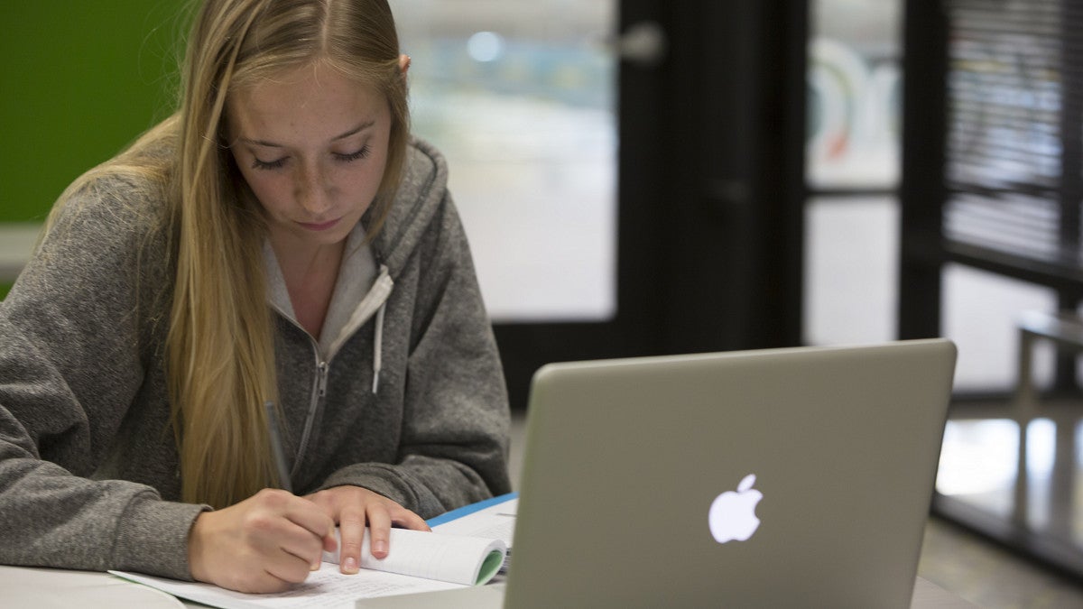 student studying alone with laptop
