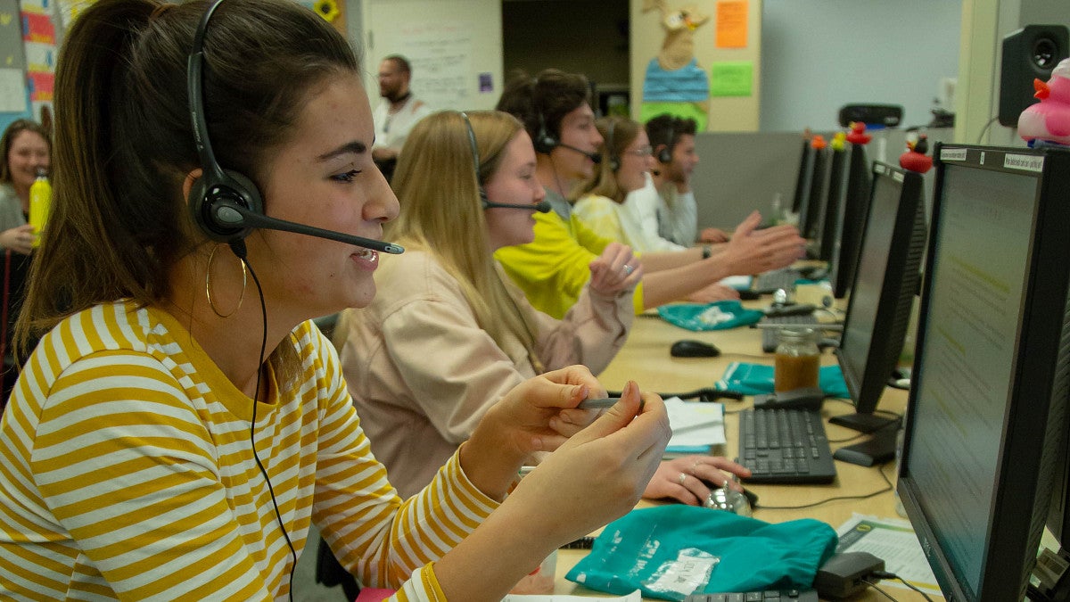 students working at call center