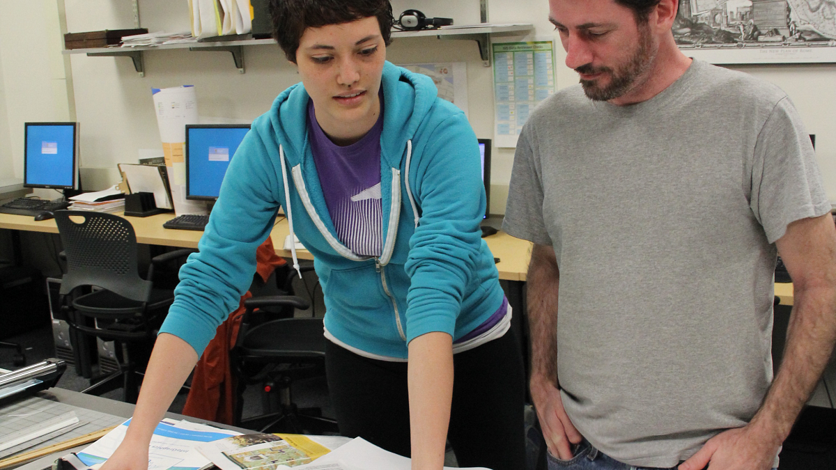 students reviewing materials in infographics class