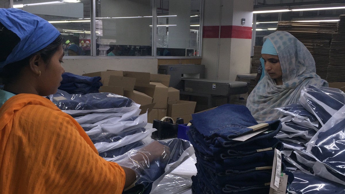 Two women working in a factory