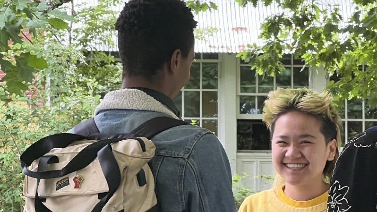 Two students talking on campus