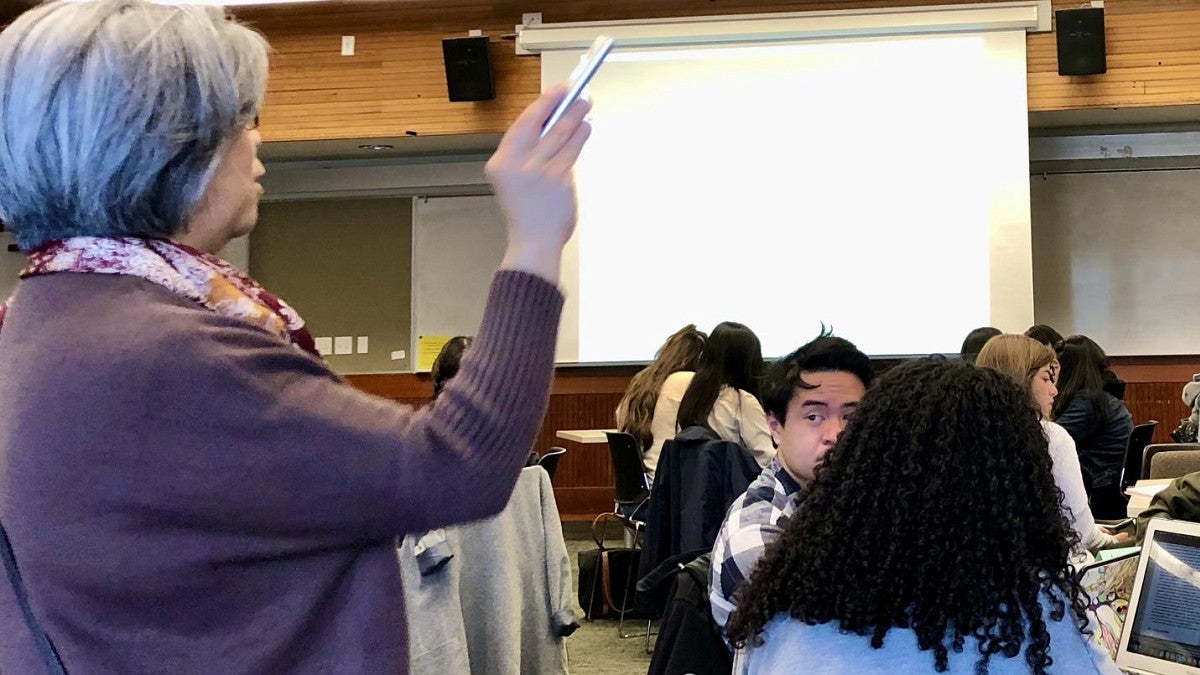 Faculty member Lynn Fujiwara in a classroom teaching students