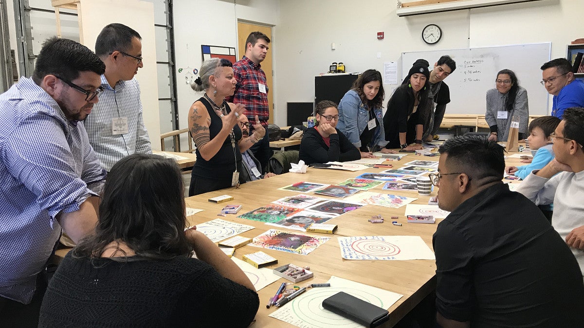 Group of students and faculty at a children's book writing workshop