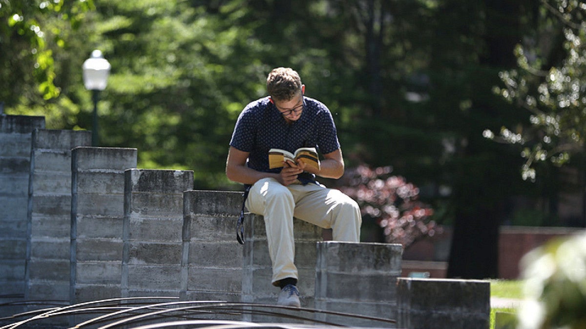 Student reading book