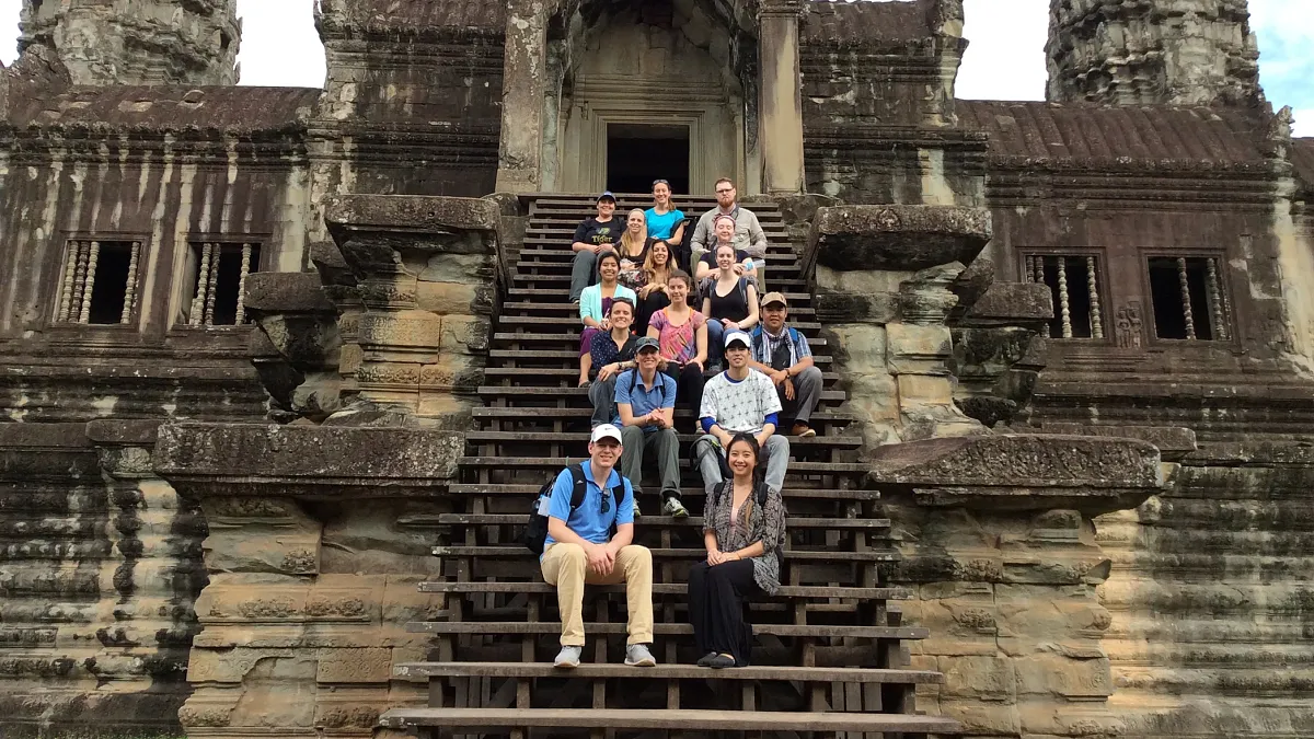 Students sitting on temple steps