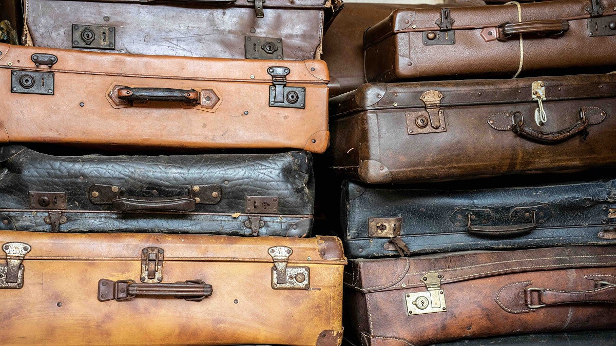 suitcases piled up that represents the Holocaust