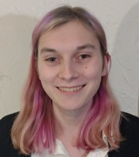 Student smiling against white background