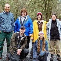 ELP 2005-2006 group posing outside in rain gear