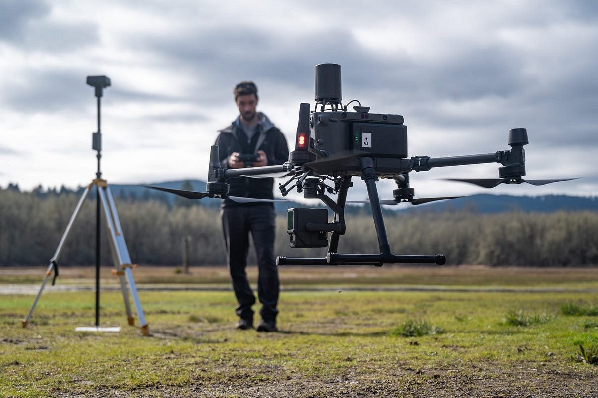 Drone taking off with student in background