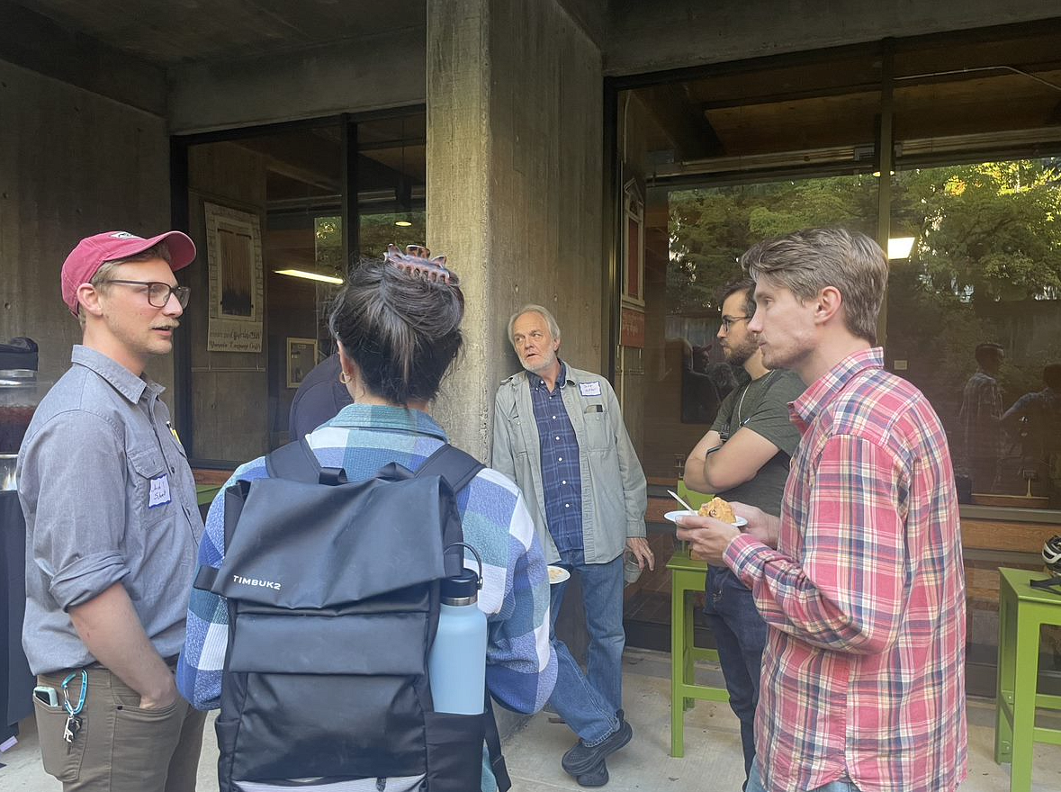 Students and Faculty standing in McKenzie courtyard in conversation.