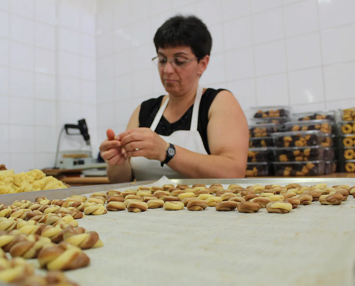 a person makes food in Greece