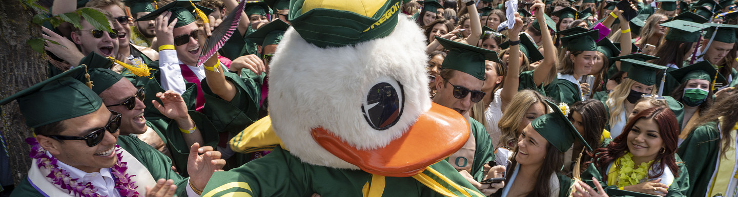 The Duck mingling with graduating students during the commencement parade