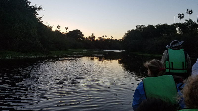 Students on a boat at sunset in Bolivia