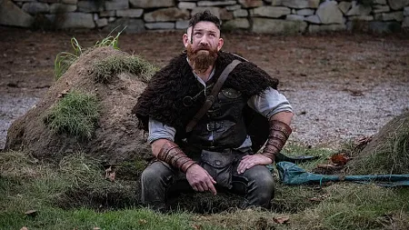 alumni devan long in costume as a viking, in a still from TV series Ghosts. 
