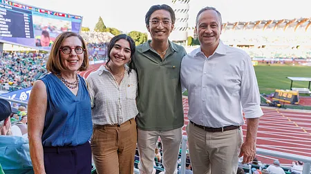 Truman scholar Luda Isakharov with Kavi Shrestha and Kate Brown at a Hayward Field event