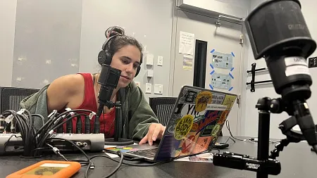 a student recording a podcast