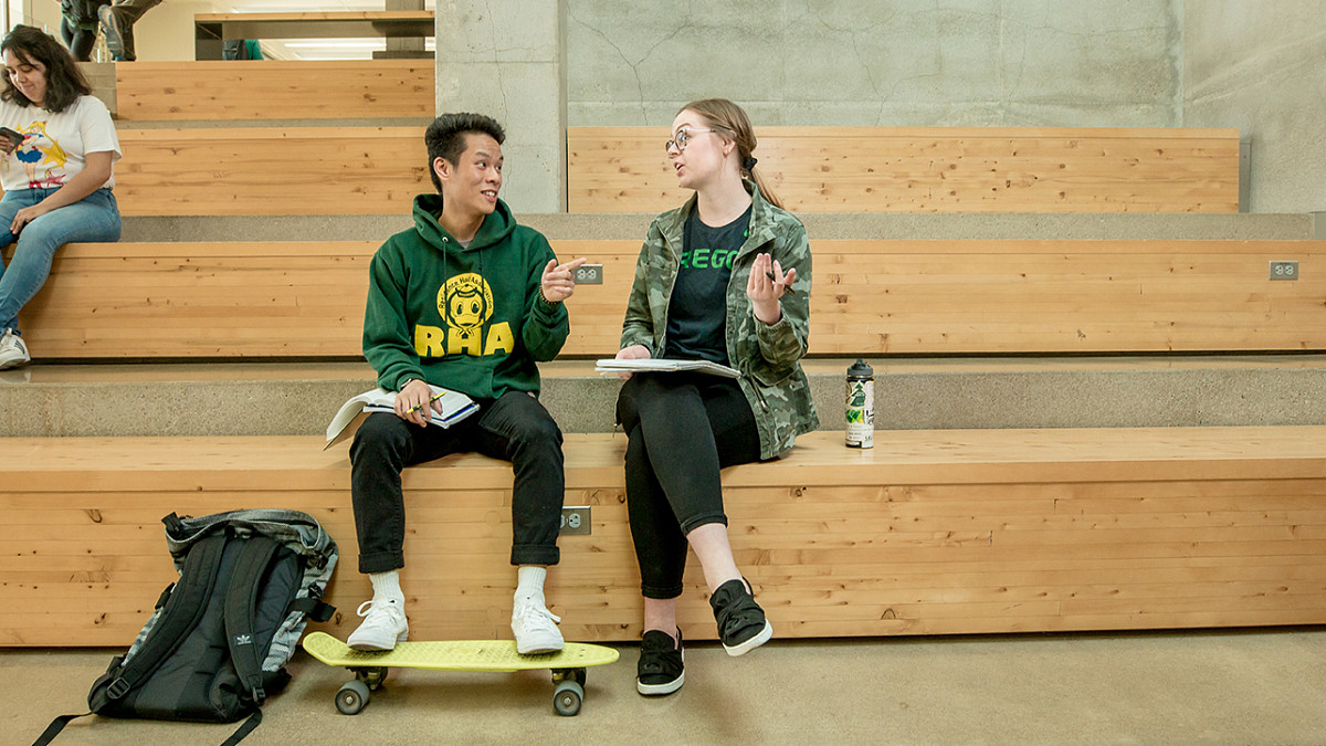 Two students talking in the EMU