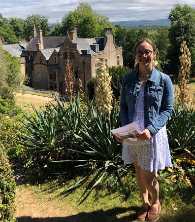 Graduate student Michele Pflug researching in the field