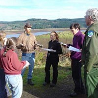 ELP 2002-2003 group at edge of reservoir with clipboards